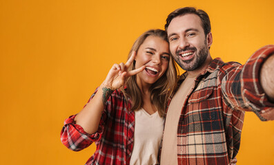 Portrait of a cheerful young couple embracing