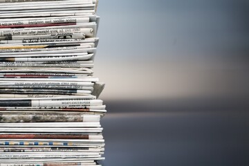 Pile of fresh newspapers on a blur background