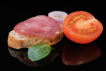 A sandwich with raw smoked sausage