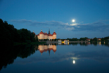 Fototapeta na wymiar Hunting Castle Moritzburg Near Dresden With Full Moon And Reflections In The Pond