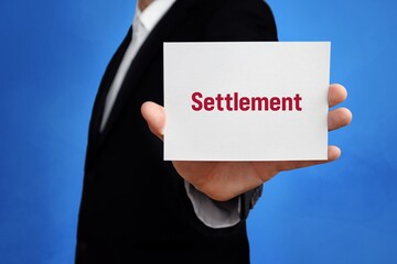 Settlement. Lawyer (man) holding a card in his hand. Text on the sign presents term. Blue background.