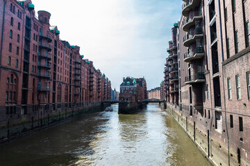 Old warehouses next to a canal in HafenCity, Hamburg, Germany