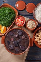 Typical Brazilian dish called Feijoada. Made with black beans, pork and sausage. Top view