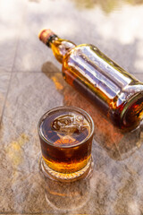 Liquor in glass and liquor bottles Alcoholic beverage concept
