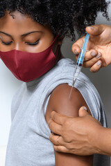 young teenage girl being vaccinated, Covid-19