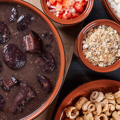 Typical Brazilian dish called Feijoada. Made with black beans, pork and sausage. Top view