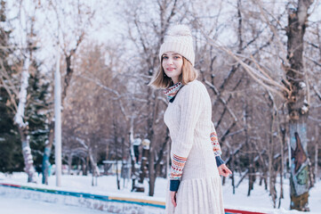 Happy girl enjoys falling snow