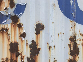 Old paint on a shipping container. Paint texture. Rust.
