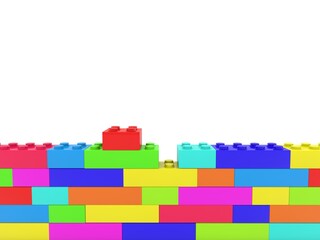 Colored toy bricks in an unfinished wall