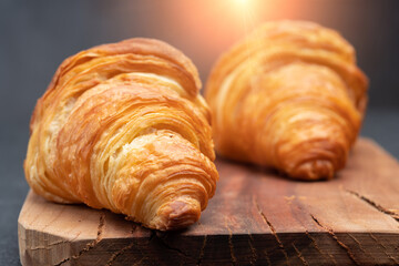 Delicious snack croissant on black background