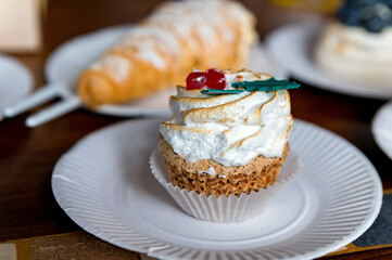 Small vanilla cupcake tarts with mozzarella cream and berries