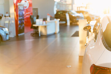 New cars at dealer showroom with blurred background