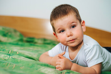 Boy is playing home and making face expressions