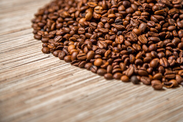 coffee beans lie on a wooden table