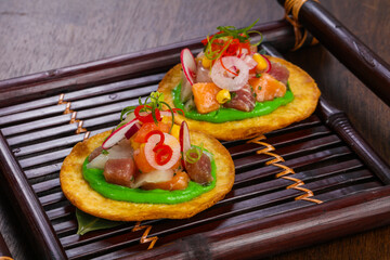 Taco with tuna and salmon