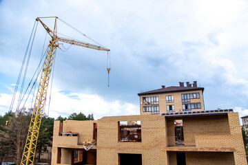 building under construction with crane