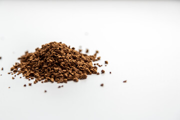 instant coffee sprinkled on white background