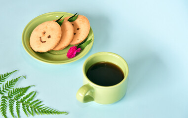 Smiling face cookies isolated with a blue light background
