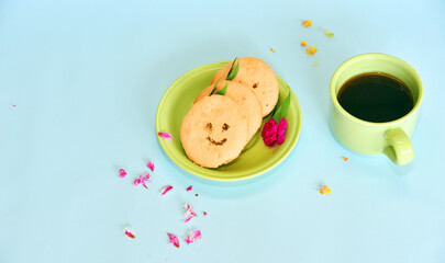 Smiling face cookies isolated with a blue light background