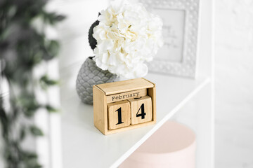 Wooden Perpetual Desk Calendar - Home and Office Decoration. 14th of February - Library Lovers Day, International Book Giving Day, World Marriage Day