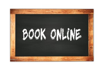 Obraz premium BOOK ONLINE text written on wooden frame school blackboard.