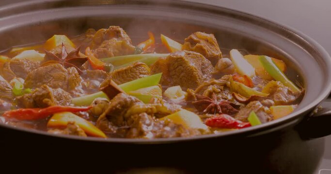 The fragrant braised beef stewed in a clay pot