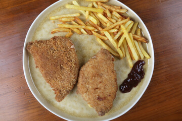 breaded meat with fried potatoes and edamame as kids food