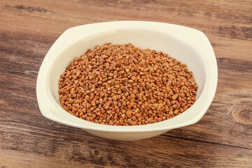 Raw buсkwheat cereal in the bowl