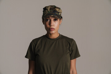Confident african american soldier woman posing and looking at camera