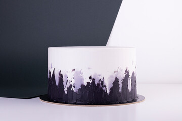 beautiful black and white cake on a white table