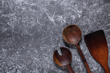 wooden cooking utensils. Concrete texture concept background