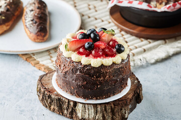 Black forest cake, Schwarzwald pie, dark chocolate and cherry dessert on a white wooden background.