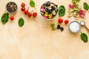 Fototapeta na wymiar Italian colorful pasta with tomatoes and fresh basil, top view