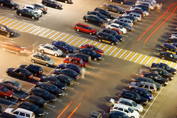 large parking lot in front of the store in the evening. view from above