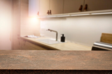 A wooden table in the kitchen surrounded by a nice family atmosphere