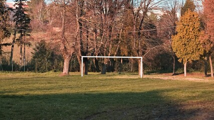 An isolated football goal in a city park surrounded by greenery (Pesaro, Italy, Europe)