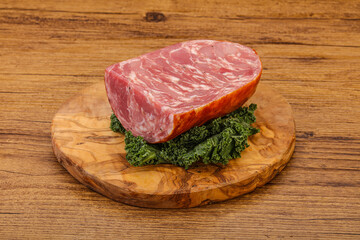 Beef ham piece over board