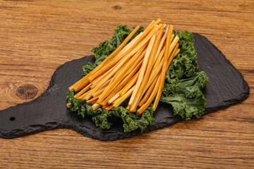 Chechel cheese sticks over board