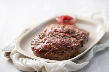 fried ground meat with tomato sauce on dish