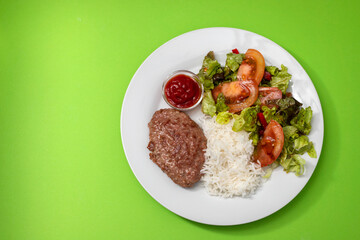 fried ground meat with tomato sauce and boiled rice on dish
