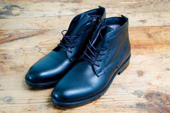 Stylish men black shoes on old wood background image