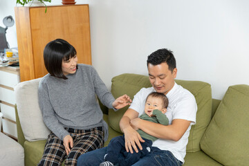 Portrait of a happy asain family in living room