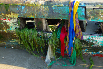 Fototapeta na wymiar old abandoned boat with debris