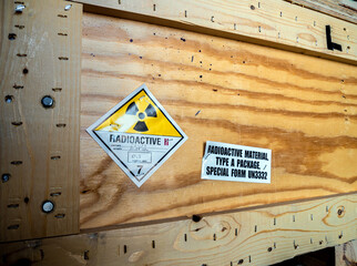 Radiation label beside the transport wooden box Type A package