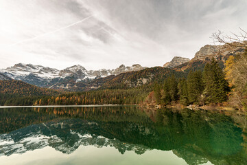 Lake Tovel (Lago di Tovel) and the Brenta Dolomites (Dolomiti di Brenta) in Italian Alps, National Park of Adamello Brenta. Trentino Alto Adige, Trento province, Italy, Europe.