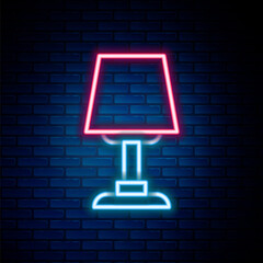 Glowing neon line Table lamp icon isolated on brick wall background. Desk lamp. Colorful outline concept. Vector.
