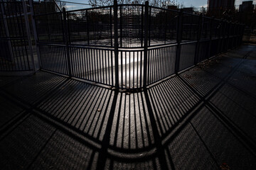 the shadow of bars in the park