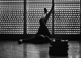 silhouette of a girl lying on the floor