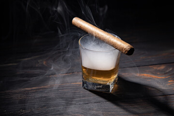 glass of whiskey and cigar