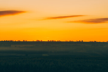 Beautiful morning landscape before sunrise in rural space, vibrant colors.